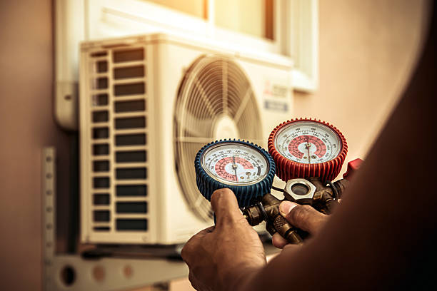 Professional Air Conditioning Service technician working in Bolton Landing, NY